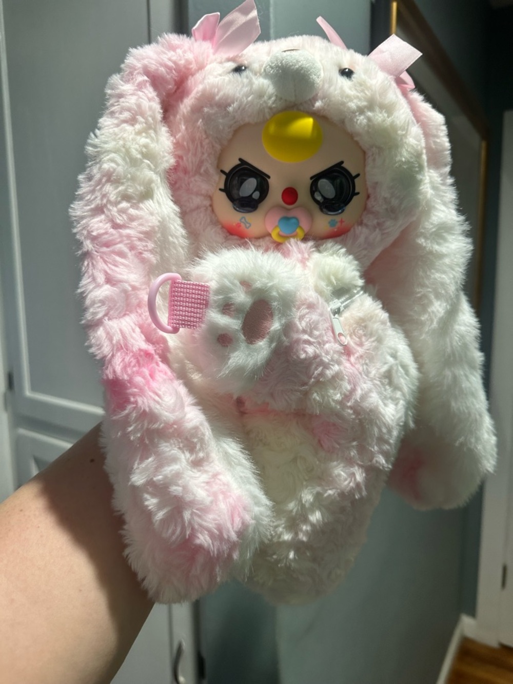 Baby three backpack with pacifier and crying eyes